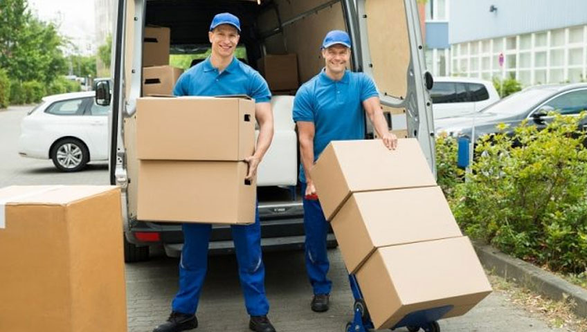 Men shifting the boxes while Relocating Office in Unicorn movers